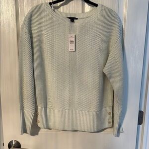 Women's Light Green White Sweater with side button details.